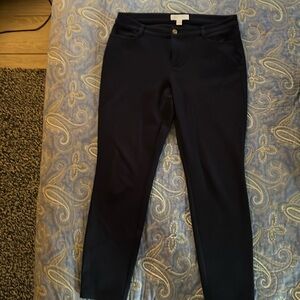 Michael Kors Navy Pants fabric has stretch. From a smoke free, pet free home.